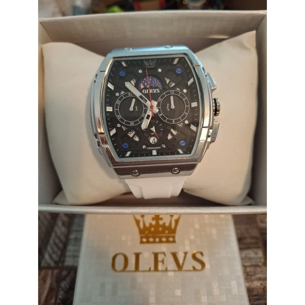 NIB OLEVS 2942G Mens Watch. Chrono W/Moon Phase Calendar,SS Case,White Strap.